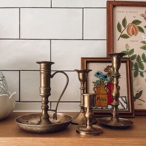four brass candle holders